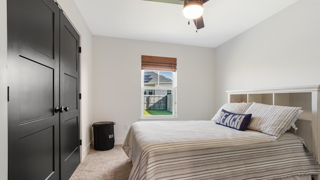 carpeted bedroom with ceiling fan