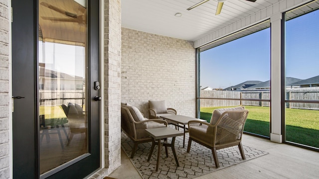 sunroom / solarium with ceiling fan