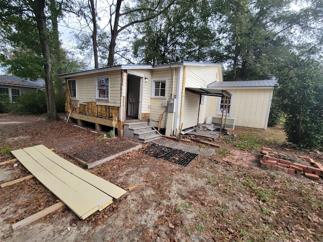 rear view of property with a deck