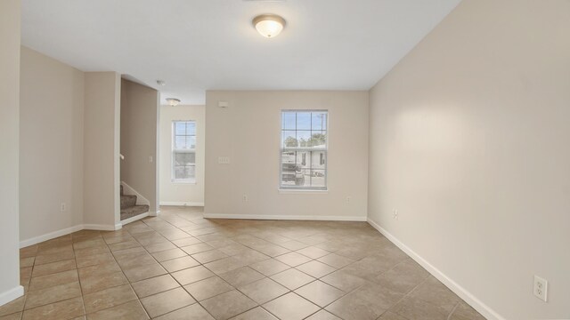 empty room with light tile patterned floors