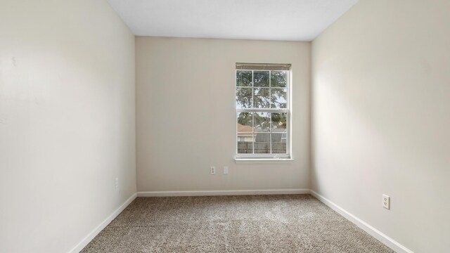 empty room with carpet flooring