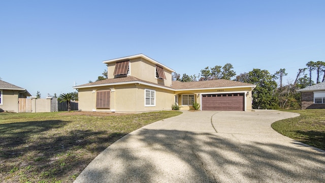 view of front of house featuring a garage and a front yard