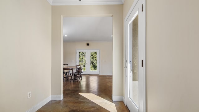 corridor featuring french doors and crown molding