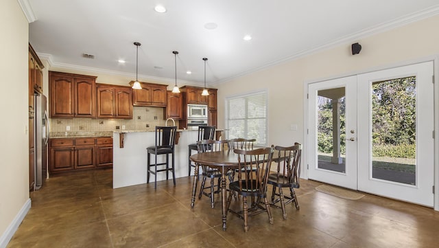 dining area with crown molding