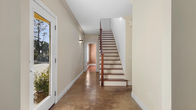 foyer entrance featuring ornamental molding