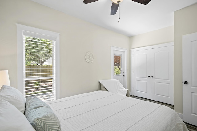 bedroom featuring ceiling fan and a closet