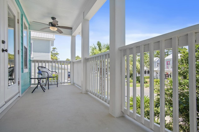 balcony with a porch and ceiling fan