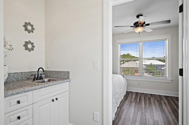 bathroom featuring vanity, hardwood / wood-style floors, and ceiling fan