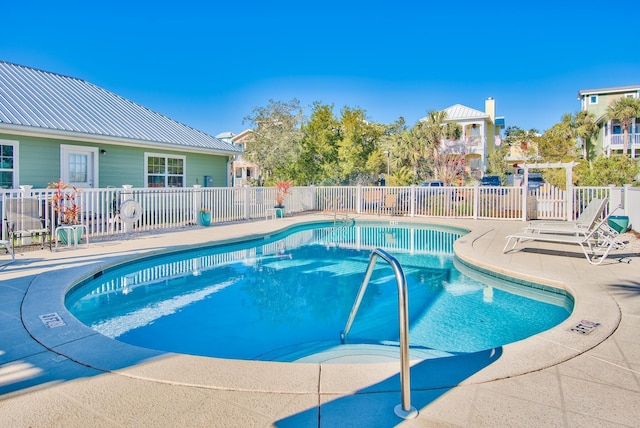 view of pool featuring a patio and a pergola