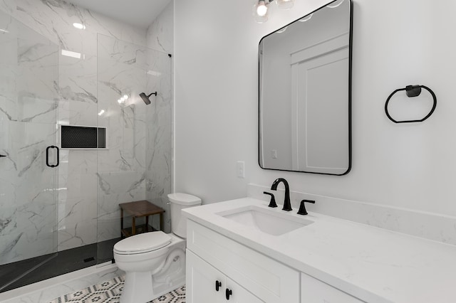 bathroom with tile patterned flooring, vanity, toilet, and a shower with shower door