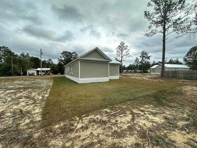 view of property exterior featuring a lawn