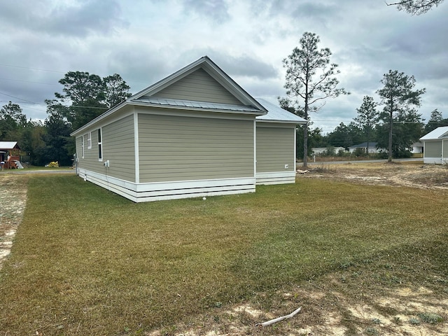 view of home's exterior featuring a lawn