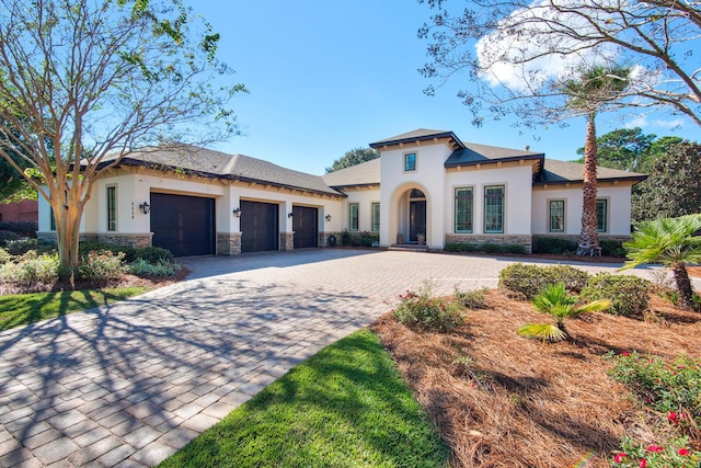 mediterranean / spanish home featuring a garage