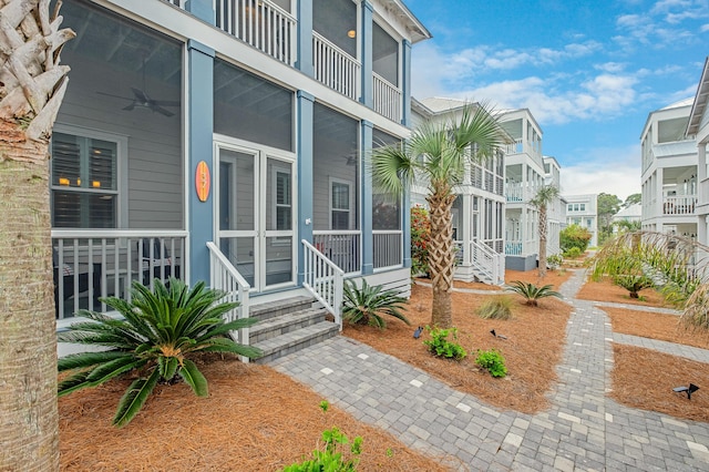 property entrance featuring ceiling fan