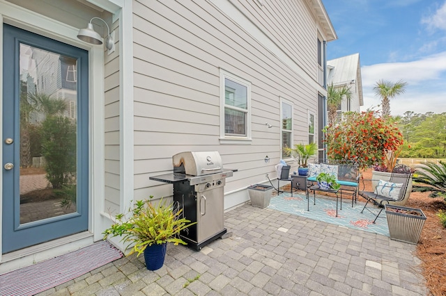 view of patio featuring a grill