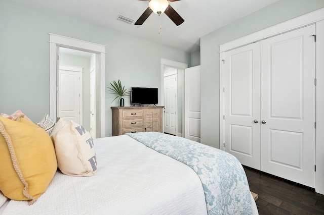 bedroom with ceiling fan and dark wood-type flooring