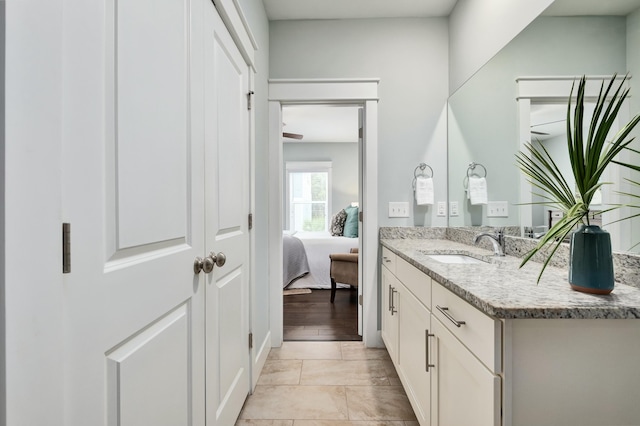 bathroom with vanity and hardwood / wood-style flooring