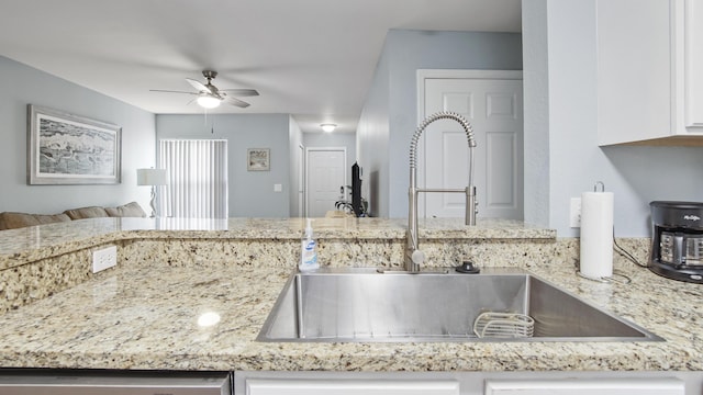 kitchen featuring white cabinets, ceiling fan, dishwasher, and sink