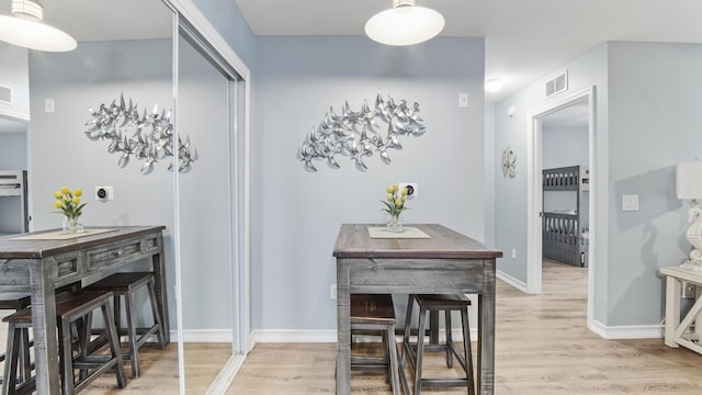 dining room with light hardwood / wood-style floors