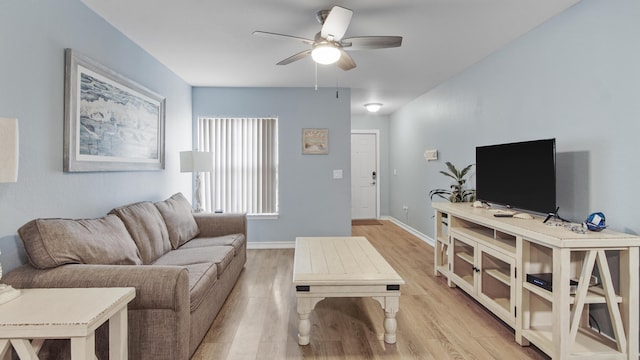 living room with ceiling fan and light hardwood / wood-style floors