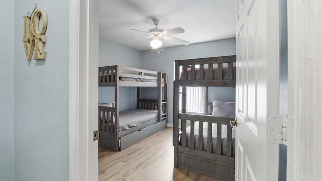 bedroom with ceiling fan and light wood-type flooring