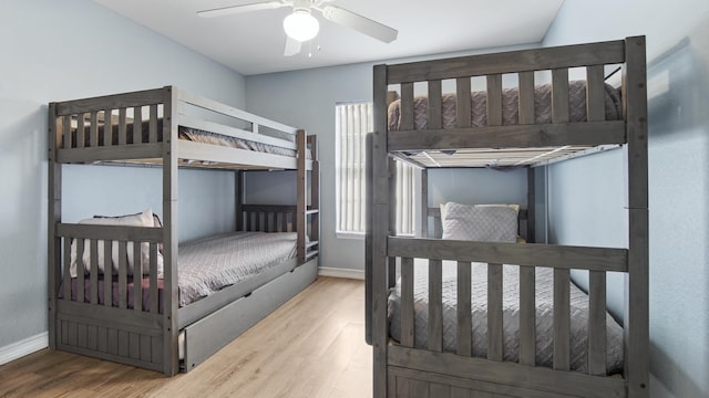 bedroom featuring hardwood / wood-style floors and ceiling fan