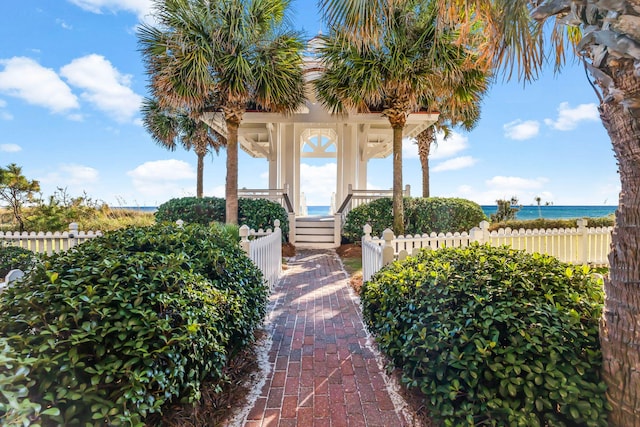 view of exterior entry featuring a water view