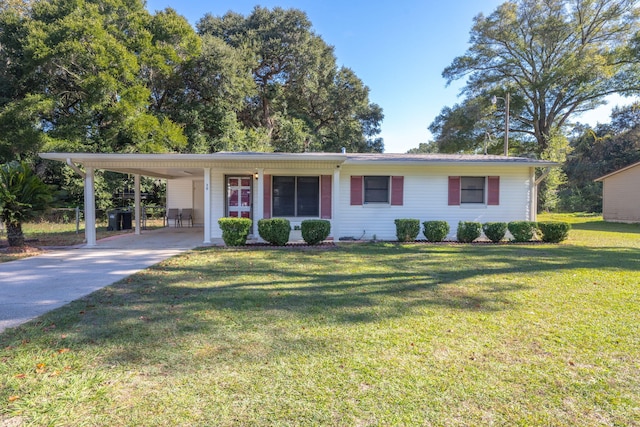 ranch-style house featuring a carport and a front lawn