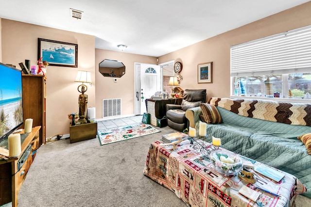 living room featuring a wealth of natural light and carpet