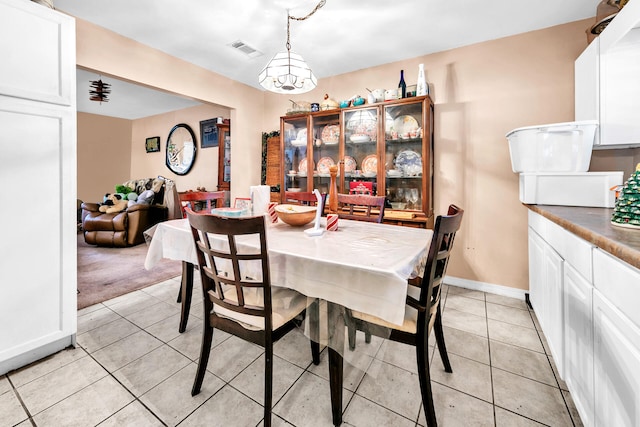 dining room with light colored carpet