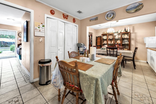 tiled dining area with ornamental molding