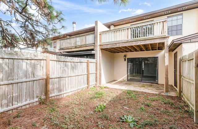 back of property featuring a patio area