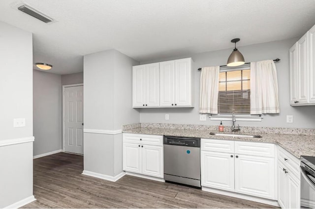 kitchen featuring white cabinets, sink, hanging light fixtures, stainless steel dishwasher, and dark hardwood / wood-style flooring