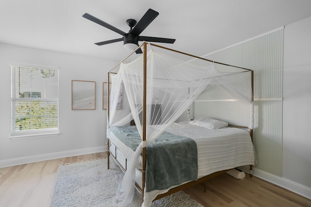 bedroom featuring ceiling fan and hardwood / wood-style flooring