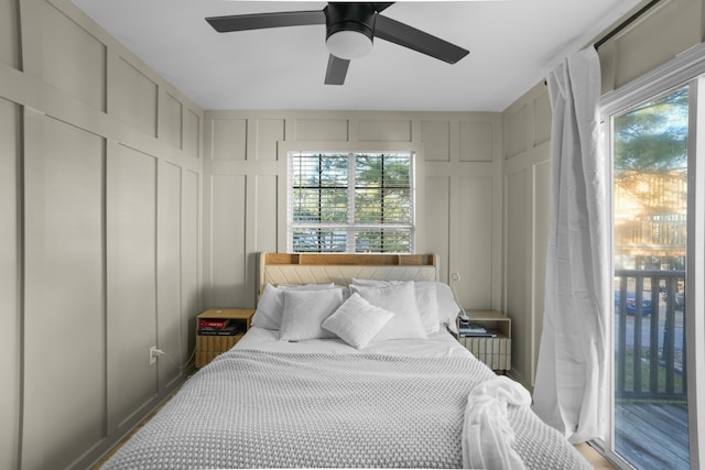 bedroom featuring ceiling fan, access to outside, and multiple windows