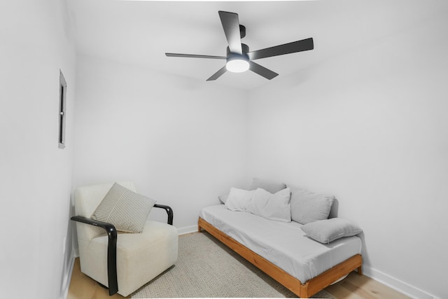 sitting room with light hardwood / wood-style flooring and ceiling fan