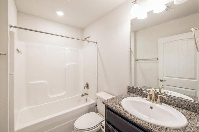 full bathroom with vanity,  shower combination, and toilet