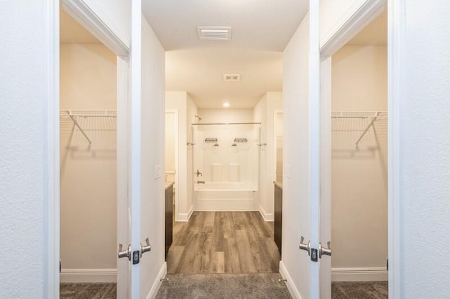 hallway featuring dark hardwood / wood-style flooring