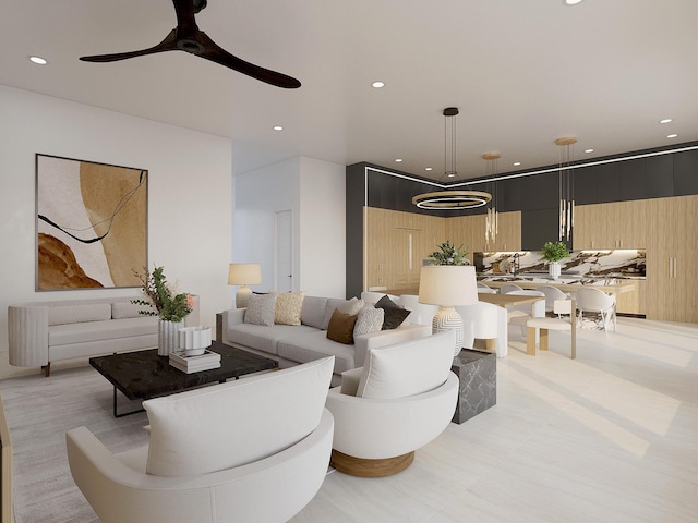 living room with wooden walls and ceiling fan with notable chandelier