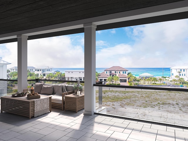 view of patio / terrace with outdoor lounge area, a balcony, and a water view