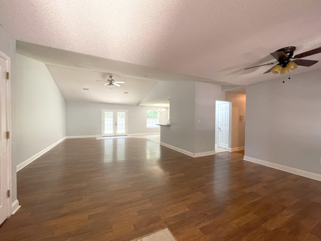 unfurnished room featuring a textured ceiling and dark wood-type flooring