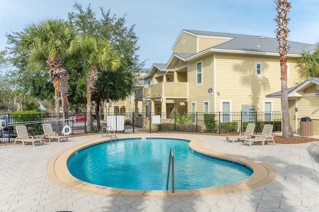 view of pool featuring a patio