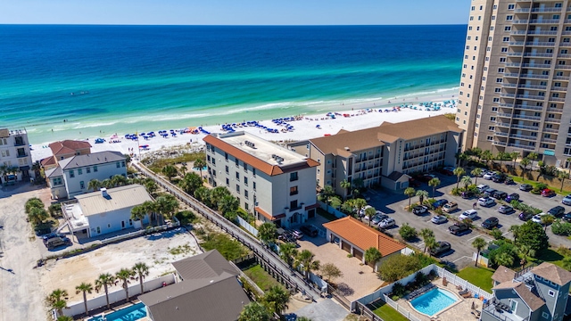 drone / aerial view with a water view and a view of the beach