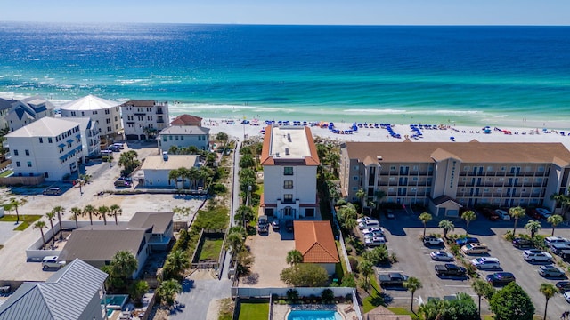 birds eye view of property featuring a water view and a view of the beach