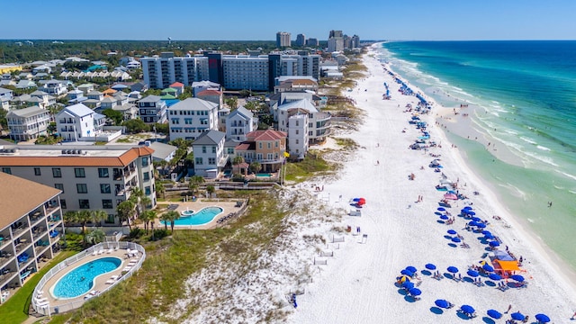 birds eye view of property featuring a view of the beach and a water view