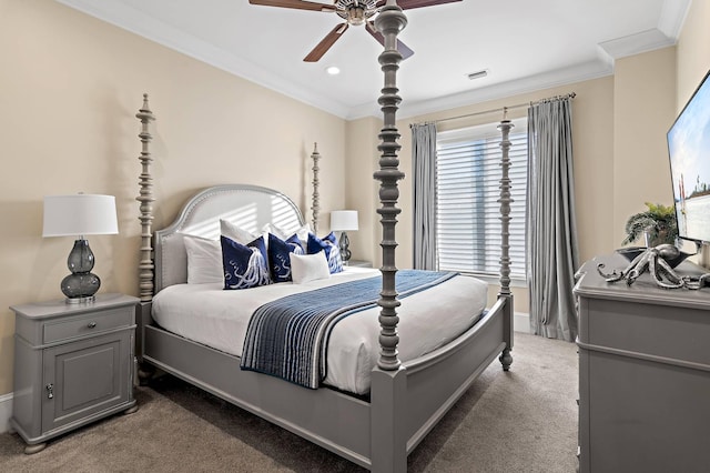 bedroom with ceiling fan, carpet, and crown molding