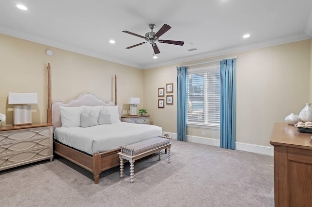 carpeted bedroom featuring ceiling fan and crown molding