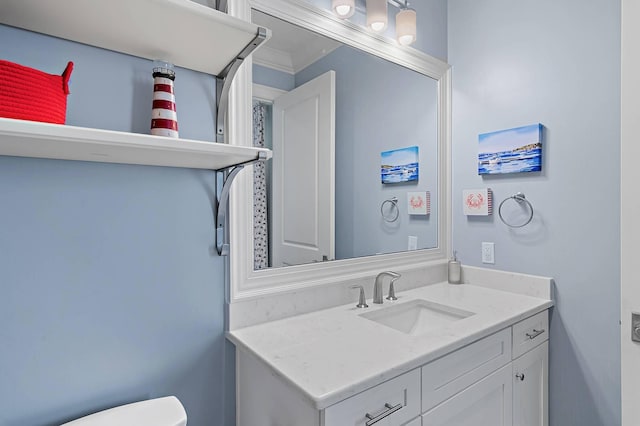 bathroom featuring vanity and crown molding