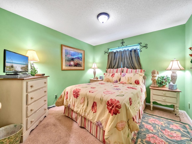 carpeted bedroom featuring a textured ceiling