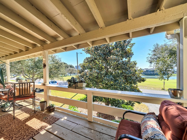 deck featuring a water view